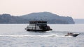 Passenger and car ferry boat on Lake Maggiore, midway between Verbania nad Laveno, Italy Royalty Free Stock Photo