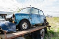 Passenger car loaded onto a tow truck for transportation Royalty Free Stock Photo