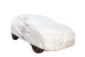Passenger car parking with plastic protective cover isolate white background