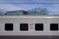 Passenger carriage of Russian railways train with the building of Otkritie FC Bank close to Paveletsky railway terminal.