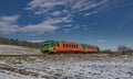 Passenger color train near Zlata Koruna station in sunny beautiful day Royalty Free Stock Photo