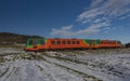 Passenger color train near Zlata Koruna station in sunny beautiful day Royalty Free Stock Photo