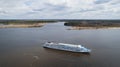 a passenger cruise ship sails along the river