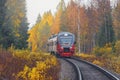 Passenger diesel local train moves to Sortavala at autumn day time. Karelia. Royalty Free Stock Photo