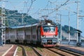 Passenger double deck train moves along the mountains. Sochi Royalty Free Stock Photo