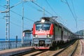 Passenger double deck train moves along the platform by the Black sea coast