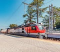 Passenger double deck train is ready to depart from the main railway station. Sochi