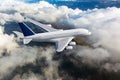 Passenger double decker plane in flight. Aircraft fly high above the clouds