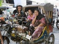 The passenger and the driver of a tuk-tuk auto rickshaws. Medan, 11 August 2011