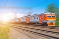 Passenger electric train long rides speed railway wagons journey light Royalty Free Stock Photo