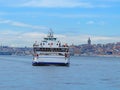 Passenger ferry on Galata Tower background