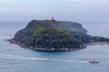 Passenger ferry and jet skis sailing around Barrenjoey Head Lighthouse.