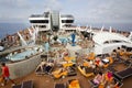 PASSENGER FERRY, MIDSEA, SPAIN - JUNE 09, 2012: Passengers enjoy at swimming pool on upper deck of The luxury cruise MSC SPLENDIDA Royalty Free Stock Photo