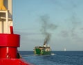 A passenger ferry motoring out of Admiralty Bay, Bequia Royalty Free Stock Photo