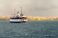 A passenger ferry sails across Toronto harbour after a storm Royalty Free Stock Photo