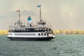 A passenger ferry sails toward Toronto harbour after a storm Royalty Free Stock Photo