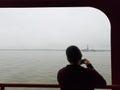 passenger on the ferry to Staten Island observing the view Royalty Free Stock Photo