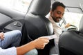 passenger giving money to smiling taxi car driver Royalty Free Stock Photo