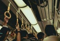 Passenger hand hold strap while standing in subway or sky train in japan Royalty Free Stock Photo