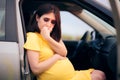 Pregnant Woman Travelling Feeling Nauseated and Car Sick Royalty Free Stock Photo