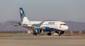 Passenger jet aircraft Airbus A319 of Aurora Airlines on runway. Aviation and transportation