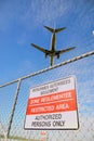 Passenger jet and airport perimeter fence