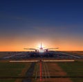 Passenger jet plane approaching on airport runways preparing to Royalty Free Stock Photo