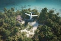 passenger light plane flies low over jungle and tropical beach Royalty Free Stock Photo
