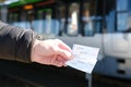 passenger, male hands hold tickets, travel passes for public transport, Hannover Stadtbahn train, typical German Public Transport