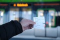 passenger, male hands hold tickets, travel passes for public transport, Hannover Stadtbahn train, typical German Public Transport