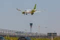 Passenger plane Airbus A220 Air Baltic airline landing at London Heathrow Airport