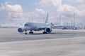 Passenger plane on airport parking. Royalty Free Stock Photo