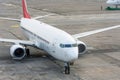 Passenger plane arrives after landing at the airport terminal Royalty Free Stock Photo