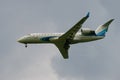 Passenger plane Bombardier CRJ-200ER VQ-BSB Yamal Airlines in a cloudy sky closeup