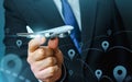 Passenger plane in businessmans hand. Commercial flight management and set new directions. Low cost travel flights. Air traffic