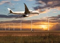 Passenger plane climbs above the farm field.