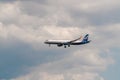 A passenger plane comes in to land from the Black sea at the airport in Gelendzhik Royalty Free Stock Photo