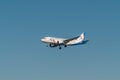 A passenger plane comes in to land from the Black sea at the airport in Gelendzhik Royalty Free Stock Photo
