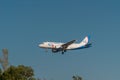 A passenger plane comes in to land from the Black sea at the airport in Gelendzhik Royalty Free Stock Photo