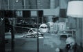 Passenger plane docked to terminal gate Royalty Free Stock Photo