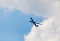 Passenger plane flies in the blue sky with clouds. Aviation industry Royalty Free Stock Photo