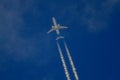 Passenger plane flying among the clouds in the blue sky closer Royalty Free Stock Photo