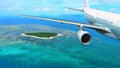 Passenger Plane Flies Over Tropical Island Royalty Free Stock Photo