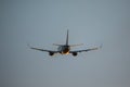 Passenger plane fly up over take-off runway from airport at sunset. Plane departure from airport. Royalty Free Stock Photo