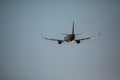 Passenger plane fly up over take-off runway from airport at sunset. Plane departure from airport. Royalty Free Stock Photo