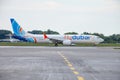 Passenger plane FlyDubai airlines Boeing 737 MAX 9, A6-FNA. Airport apron planes. Aircraft on runway. Airplane arrives Royalty Free Stock Photo