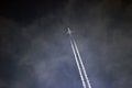 Passenger plane flying among gray clouds in the sky Royalty Free Stock Photo