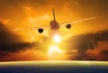 Passenger plane flying over beautiful sunset sky Royalty Free Stock Photo