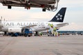 Passenger plane German airline STAR ALLIANS Airbus A-319 D-AILS. Airport apron workers. Maintenance refueling and