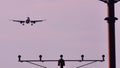 Silhouette of plane landing, runway lights, blue effect Royalty Free Stock Photo